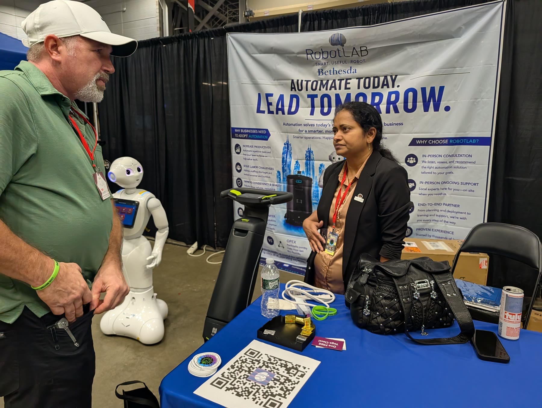 RobotLAB Bethesda booth with the Pepper humanoid robot and an Automate Today Lead Tomorrow banner