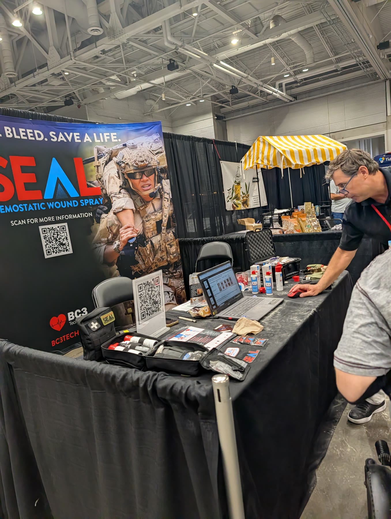 SEAL Hemostatic Wound Spray booth with Stop the Bleed banner