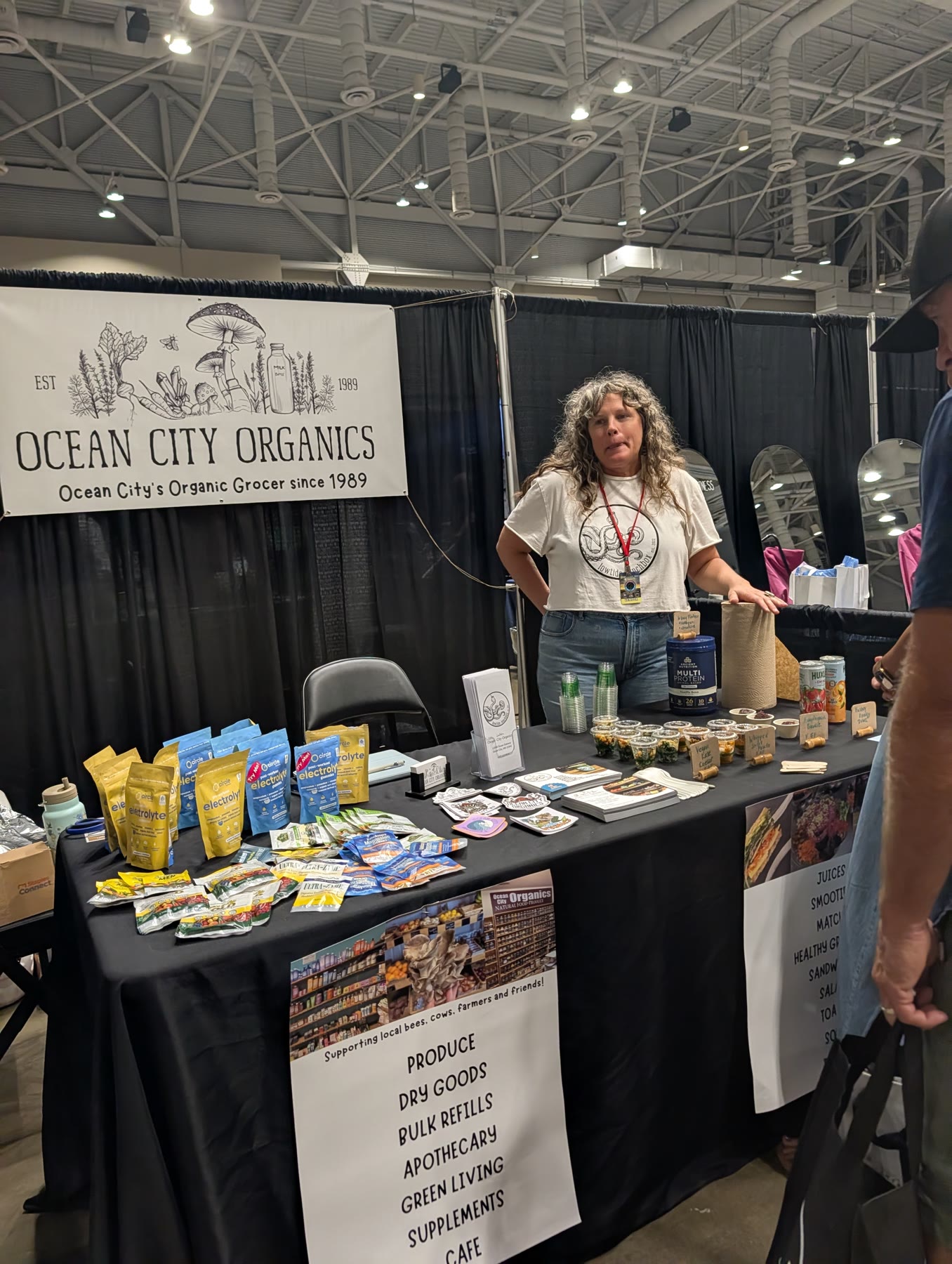 Ocean City Organics booth with organic groceries and supplements