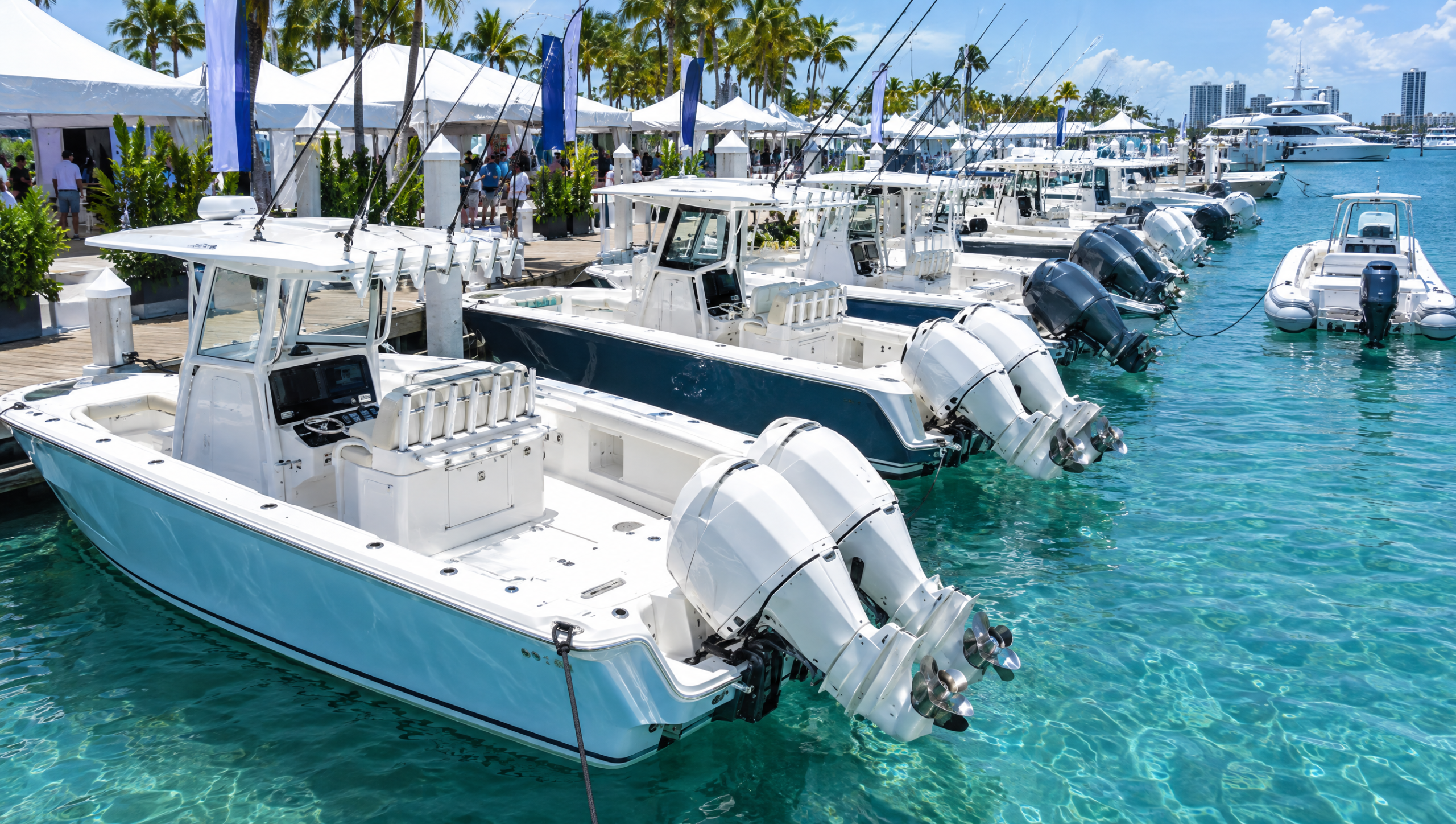 A line of center console sport fishing boats moored bow-in along a dock with outboard engines tilted up over clear turquoise water