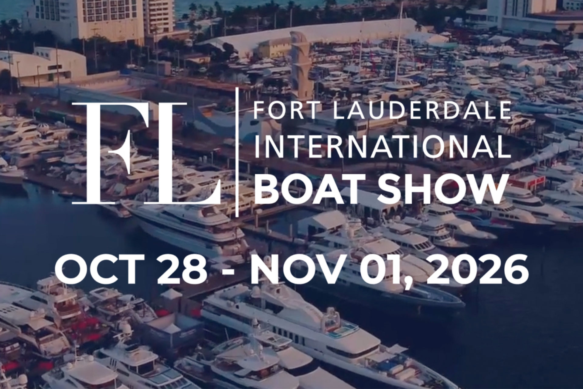 Aerial view of the Fort Lauderdale International Boat Show marina packed with yachts at dusk, with the FLIBS logo and the dates 28 October to 1 November 2026
