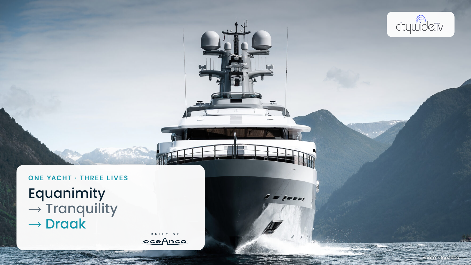 Draak, the grey Oceanco support yacht, bow-on in a fjord, with a card reading Equanimity, Tranquility, Draak and the Oceanco logo