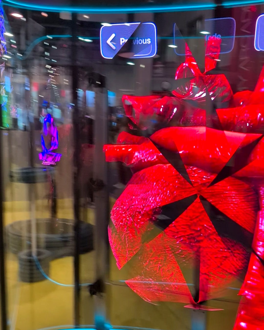 Red 3D holographic heart floating inside a glass capsule at the HYPERVSN booth, CES 2025