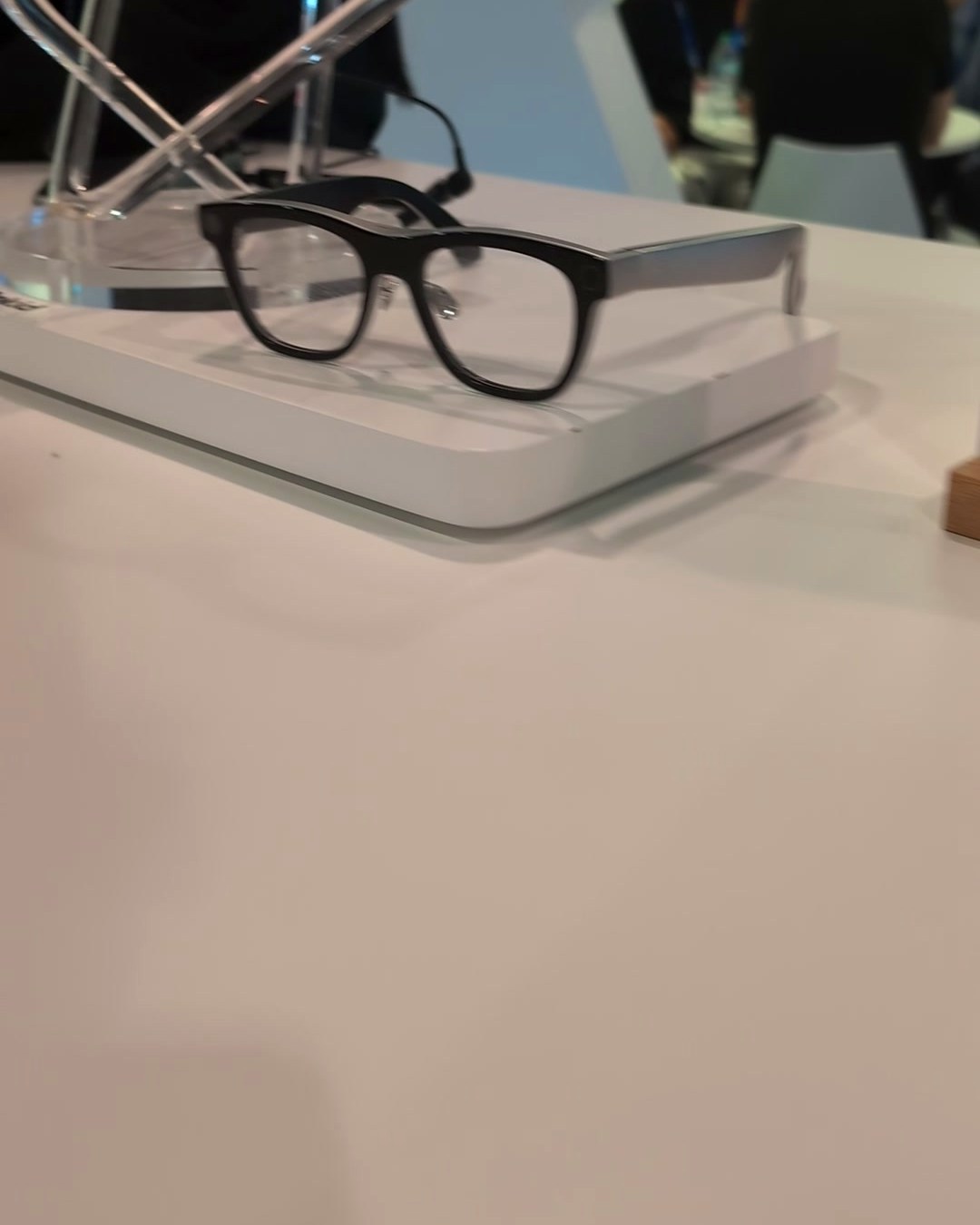 Rokid Glasses displayed on a clear acrylic stand at CES 2025